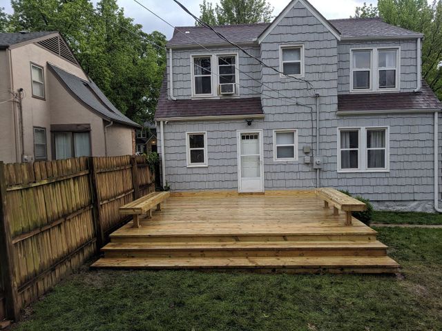 Low, ground-level deck with wide steps built by High Valley Decks